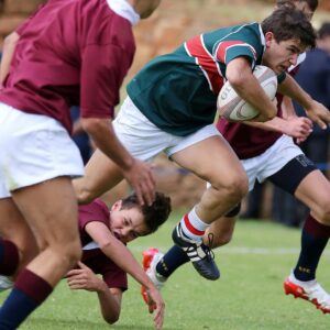 Intense rugby match with players in action, showcasing strength and teamwork.