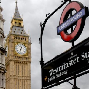 View of Big Ben and Westminster Station sign in London, England, capturing iconic British landmarks.
